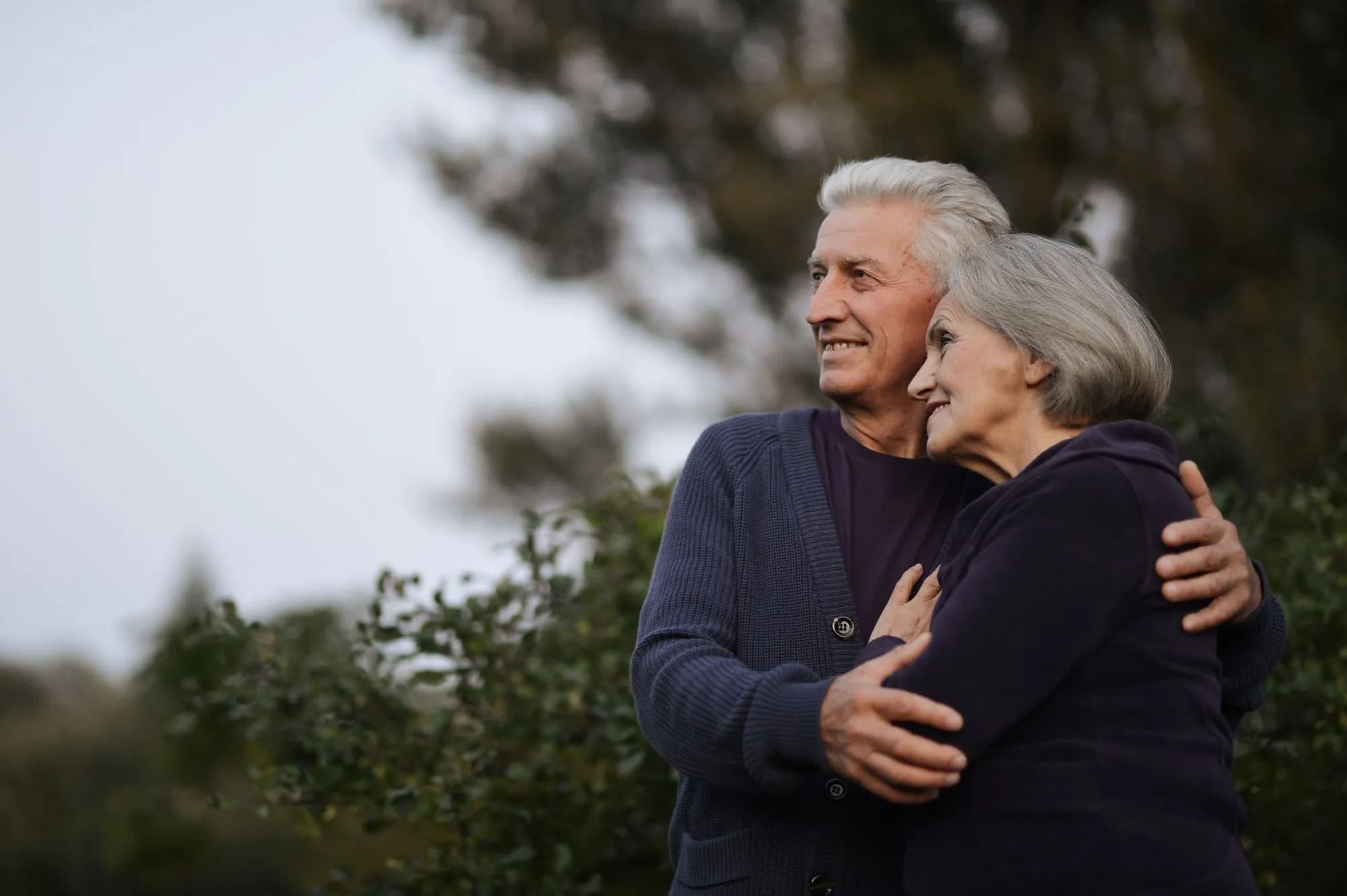 Senior couple embracing outdoors